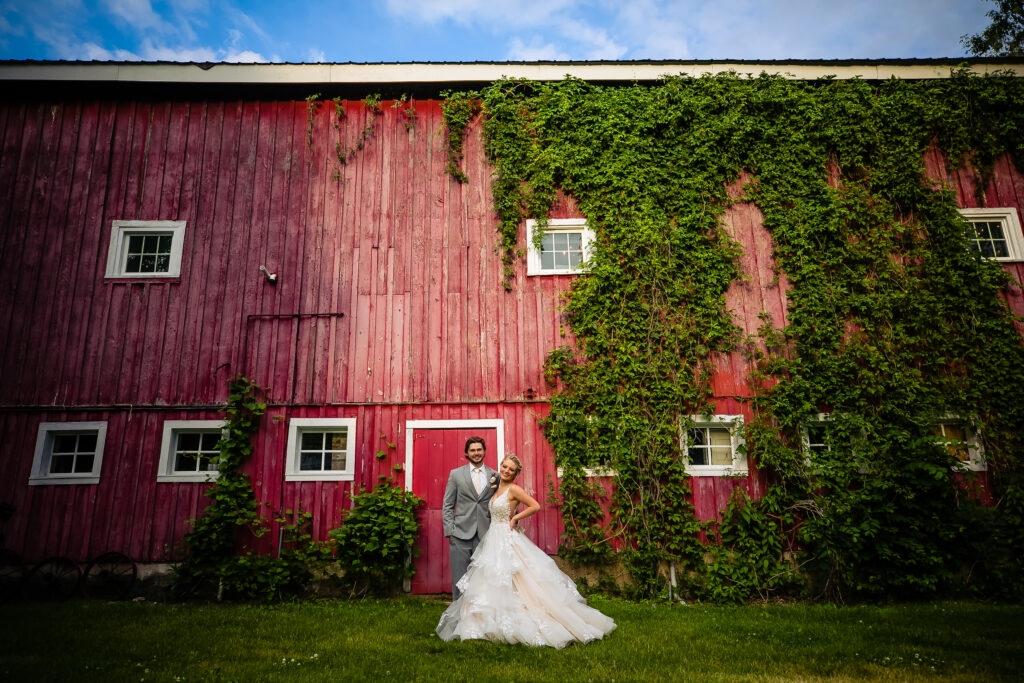 bride and groom outside barn